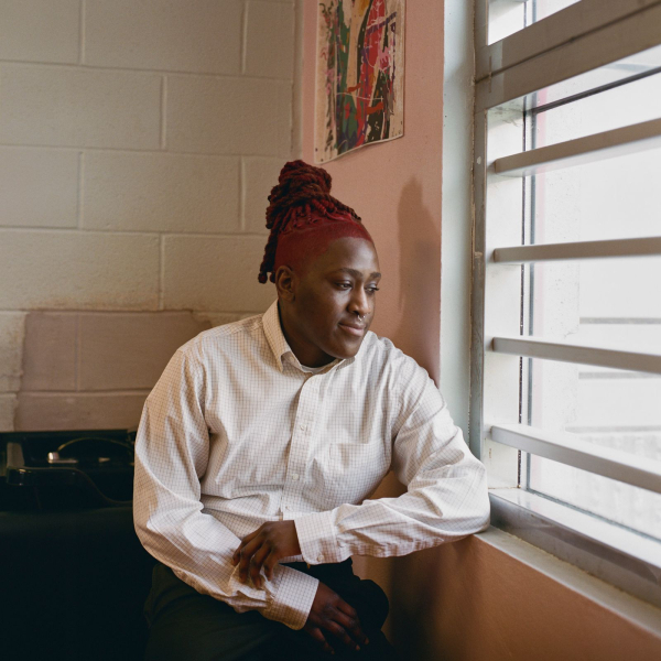 Image may contain Khari Wynn Person Sitting Adult Hair Face and Head